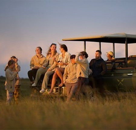 Group on Safari at sunset