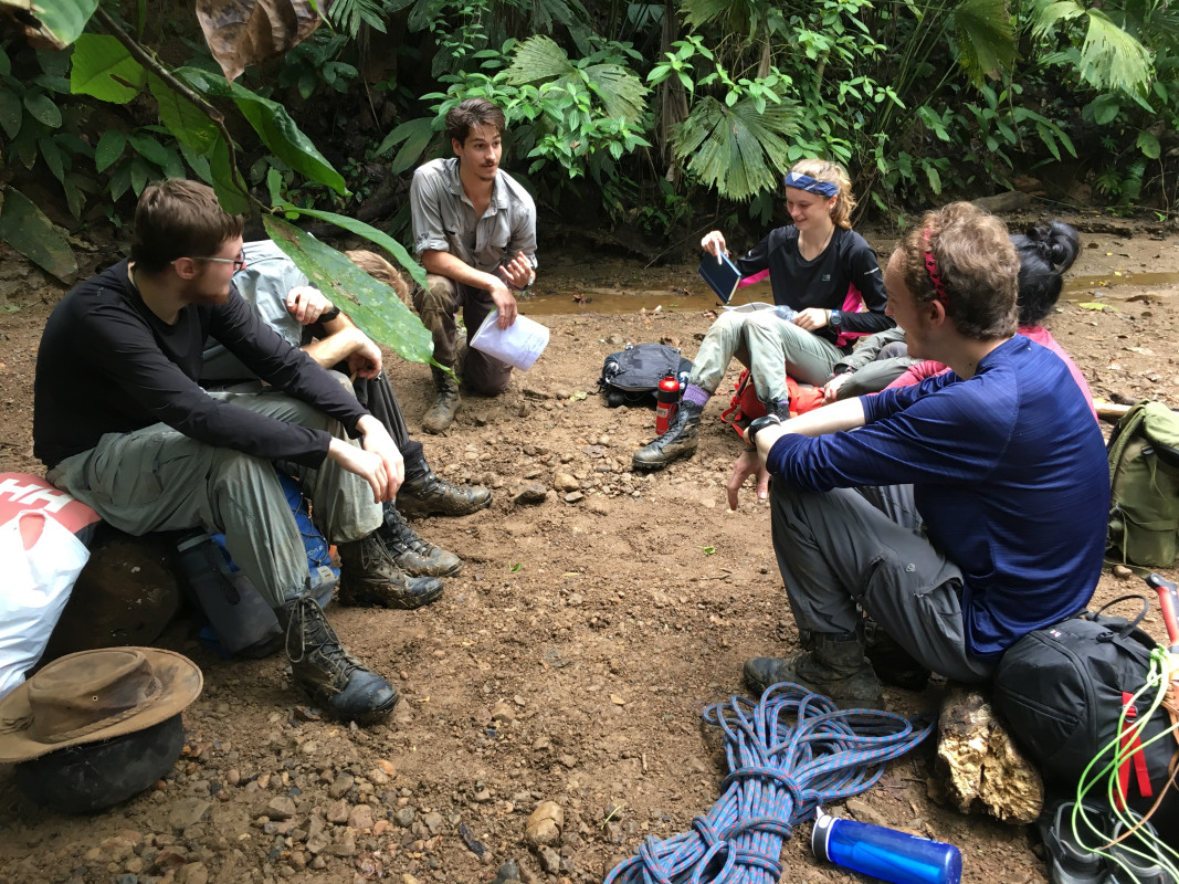A group of Gapforce participants sitting in a circle, discussing their tasks.